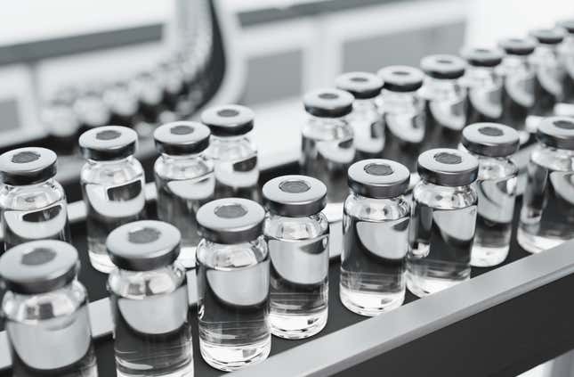 Vaccine vials on a production line in a pharmaceutical factory. 