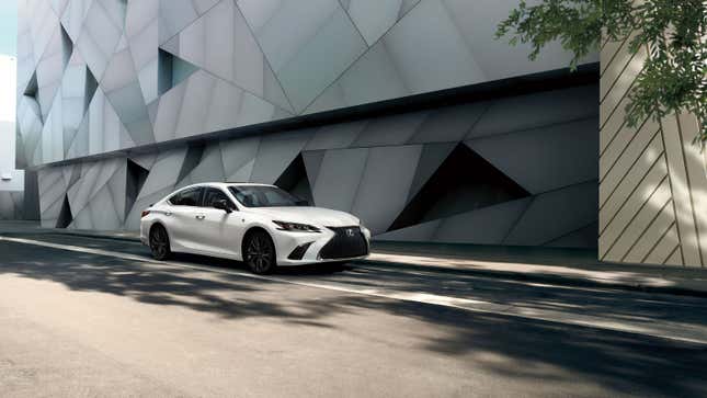 A white Lexus ES sedan parked on a road. 