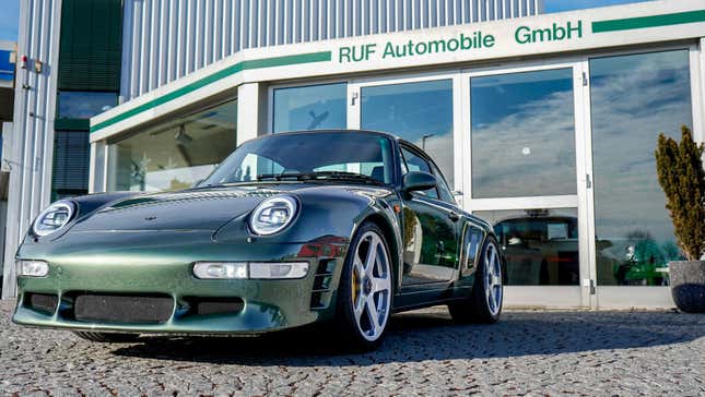 A green Ruf parked in front of Ruf offices in Germany