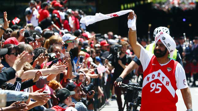 TORONTO, ON - JUNE 17: Toronto Raptors Superfan Nav Bhatia walks along the road during the Toronto Raptors Victory Parade on June 17, 2019 in Toronto, Canada. The Toronto Raptors beat the Golden State Warriors 4-2 to win the 2019 NBA Finals. 
