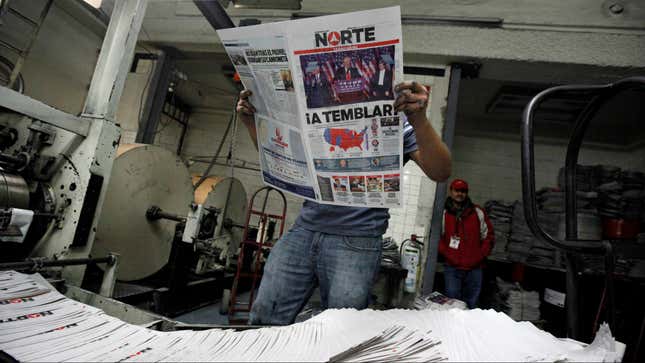 A worker reads a freshly printed newspaper with the headline reading "We will tremble" at a printer of the local daily Norte in Ciudad Juarez, Mexico, November 9, 2016.