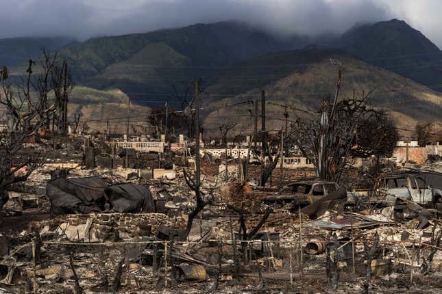 FILE - Damaged property lies scattered in the aftermath of a wildfire in Lahaina, Hawaii, Aug. 21, 2023. Officials on the Hawaiian island of Maui plan to send debris and ash from the August wildfire that destroyed Lahaina town to the island&#39;s central landfill. Local officials in Hawaii plan to open an office in April 2024, that will speed up Maui County&#39;s notoriously slow processing of building permits to help the town of Lahaina to recover from last year&#39;s deadly wildfire. Keanu Lau Hee, the county’s deputy managing director, told a community meeting in Lahaina that a County Expedited Permitting Center will open in April.(AP Photo/Jae C. Hong, File)