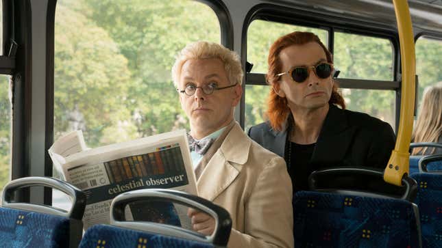The angel Aziraphale reads the paper as the demon Crowley stares at a fellow passenger on the bus.