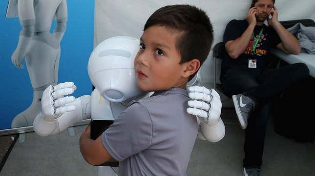 A child hugs a robot in an apparent beta version of the virtual hugging website.