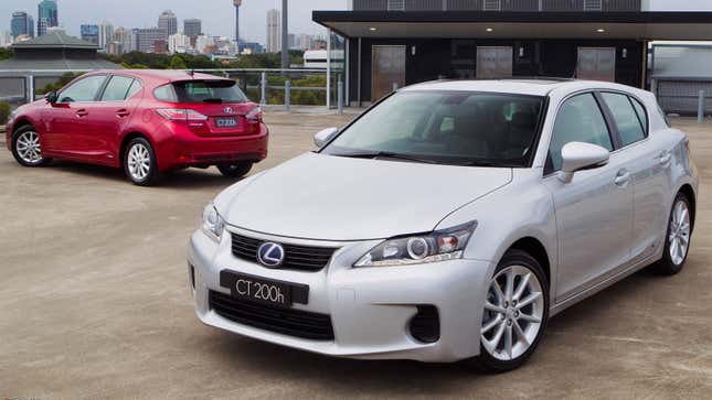 A photo of a red and a silver Lexus CT hatchback parked in a lot. 