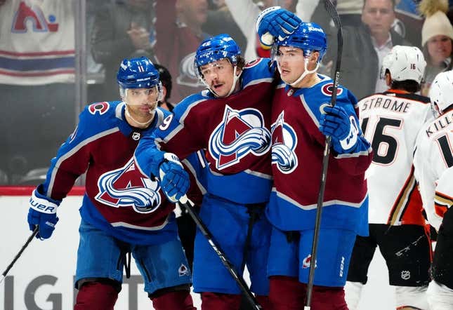 Nov 15, 2023; Denver, Colorado, USA; Colorado Avalanche defenseman Samuel Girard (49) celebrates his goal with center Ross Colton (20) and center Andrew Cogliano (11) in the first period at Ball Arena.