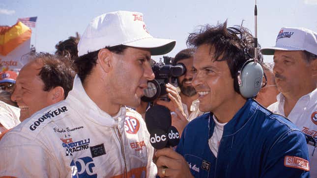 PHOENIX, AZ - APRIL 12, 1987: Broadcaster Jack Arute interviews Roberto Guerrero following his victory in the Checker 200 CART Indy Car race at Phoenix International Raceway. 