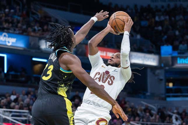 Nov 3, 2023; Indianapolis, Indiana, USA; Cleveland Cavaliers guard Darius Garland (10) shoots while Indiana Pacers forward Aaron Nesmith (23) defends in the second half at Gainbridge Fieldhouse.