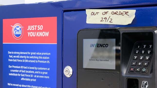 A photo of an "out of order" sign on a filling station payment terminal. 