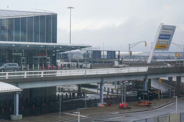 FILE - A vehicle stops at Terminal 1 at John F. Kennedy International Airport in New York, Feb. 17, 2023. The pilots of an American Airlines plane taxied across the wrong runway last year in New York — into the path of another jetliner that was taking off — after the captain became distracted and confused about takeoff instructions and the co-pilot lost track of their plane&#39;s location, according to documents released Monday, Jan. 29, 2024. (AP Photo/Seth Wenig, File)