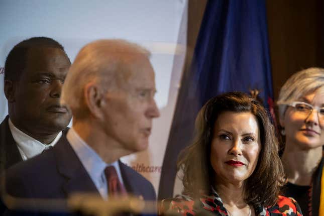 Joe Biden speaks as Michigan Governor Gretchen Whitmer looks on at an event at Cherry Health in Grand Rapids, MI on March 9, 2020