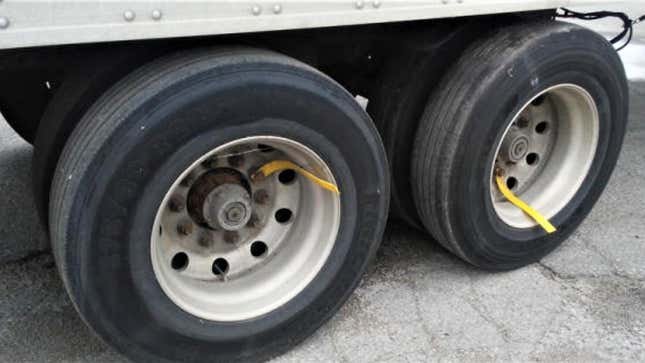 Image for article titled Here Is What Those Strips Hanging Off Of Truck Wheels Are For