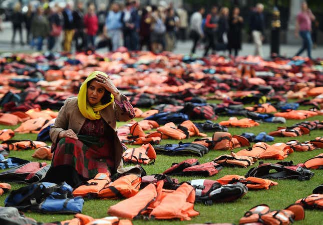 Rahela Sidiqi, of Women for Refugee Women sits amongst life jackets.