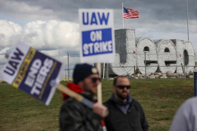 File - Striking UAW workers picket at the Jeep Assembly Plant on Oct. 9, 2023 in Toledo, Ohio. The UAW contends that the furloughs by Detroit&#39;s three automakers were not necessary and are being done in an effort to push members to accept less in contract negotiations. (Jonathan Aguilar/The Blade via AP, File)