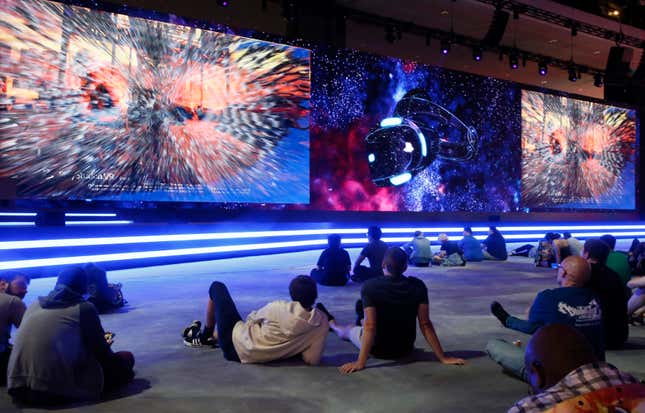 File - People watch a PlayStation VR demo at the 24th Electronic Entertainment Expo E3 on June 14, 2018 in Los Angeles. The Electronic Entertainment Expo, known as E3, which had been held annually in Los Angeles since 1995, has been shut down permanently. (AP Photo/Damian Dovarganes, File)