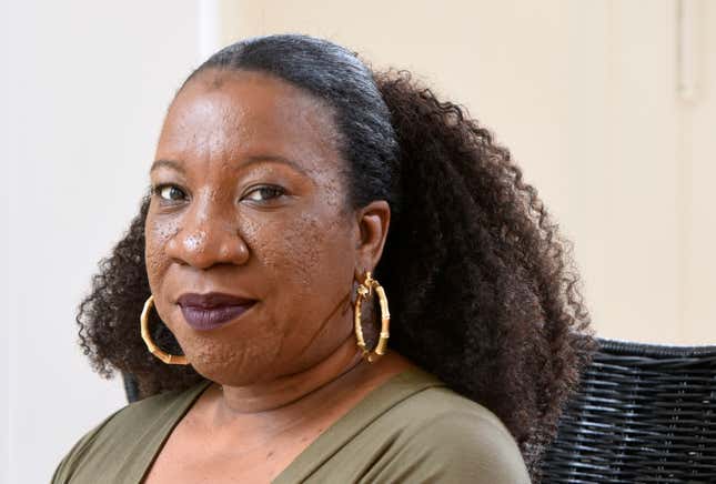 FILE - Tarana Burke, founder and leader of the #MeToo movement, sits in her home in Baltimore on Tuesday, Oct. 13, 2020. (AP Photo/Steve Ruark, File)