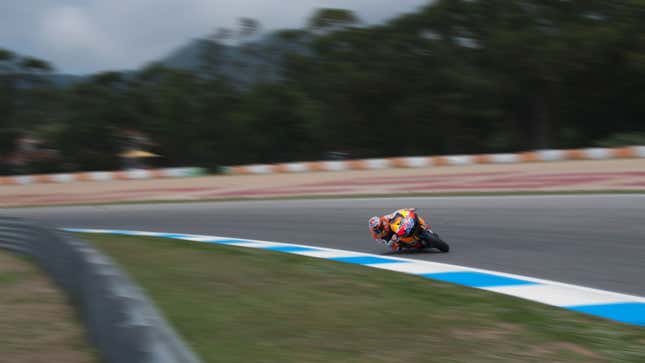 A photo of a motorbike racing in Estoril. 