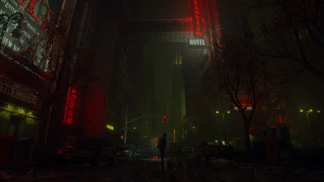 Alan is dwarfed by buildings on a city street at night, much of the illumination coming from red signs for hotels and bookstores.