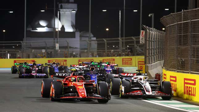 Oliver Bearman of Great Britain driving the (38) Ferrari SF-24 and Kevin Magnussen of Denmark driving the (20) Haas F1 VF-24 Ferrari battle for track position during the F1 Grand Prix of Saudi Arabia at Jeddah Corniche Circuit on March 09, 2024 in Jeddah, Saudi Arabia.