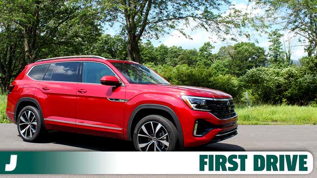 A photo of a red VW Atlas SUV with a "first drive" banner underneath. 