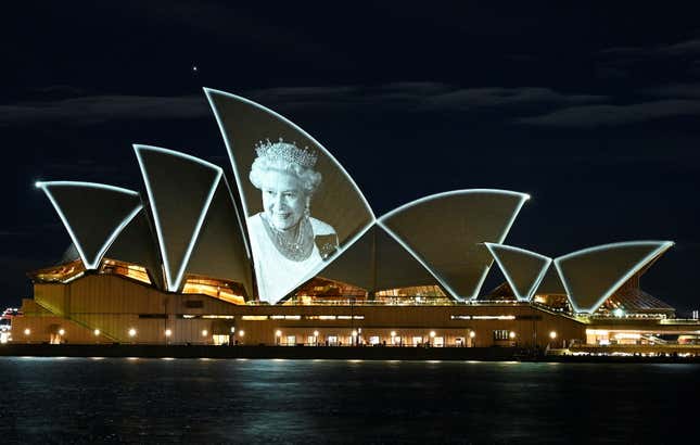 An image of Britain’s Queen Elizabeth illuminated on the sail of Sydney Opera House. 