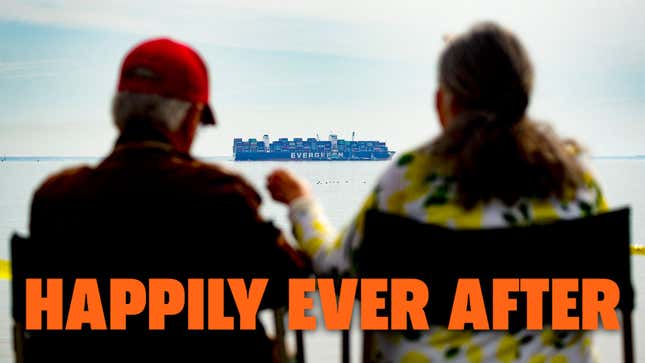 A photo of two people looking out to the Ever Forward container ship. 