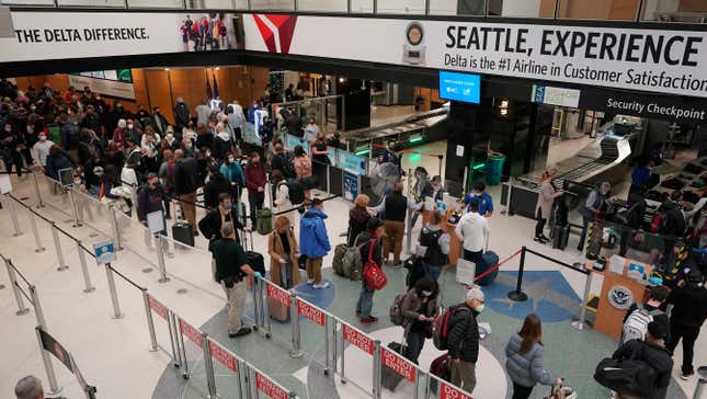 A photo of passengers at Seattle-Tacoma International Airport in 2021