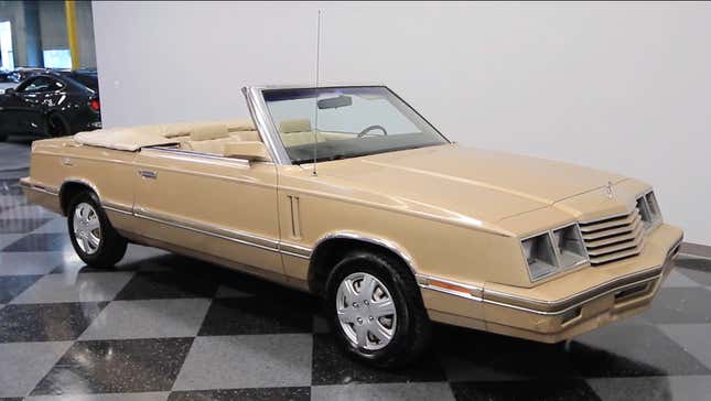 A tan Dodge 400 convertible in remarkably good shape