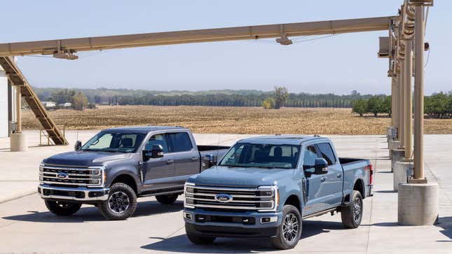 A photo of two Ford Super Duty trucks. 