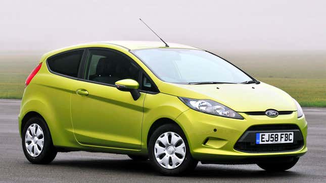 A photo of a green Ford Fiesta hatchback. 