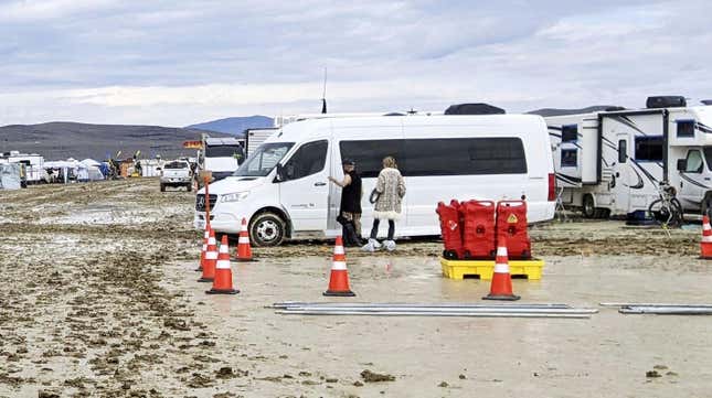 A vehicle is stuck in the mud on Sept. 2, 2023, after torrential rain during the annual Burning Man festival at the temporary settlement of Black Rock Desert, Nevada