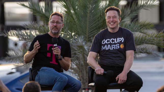 SpaceX founder Elon Musk and T-Mobile CEO Mike Sievert on stage during a T-Mobile and SpaceX joint event on August 25, 2022 in Boca Chica Beach, Texas.