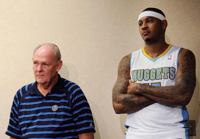 Denver Nuggets coach George Karl and player Carmelo Anthony listen during a news conference at the NBA basketball team’s media day Monday, Sept. 27, 2010, in Denver.