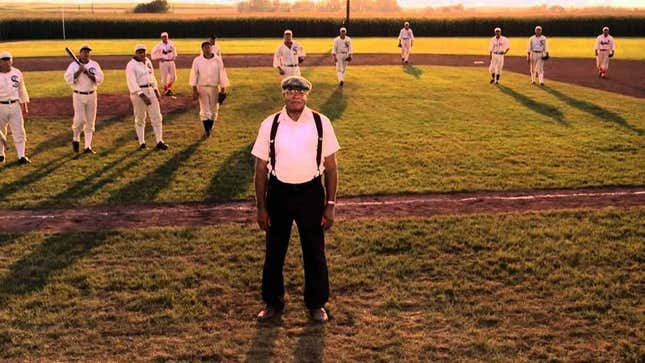 James Earl Jones stands in front of baseball players and a baseball field in Field of Dreams.
