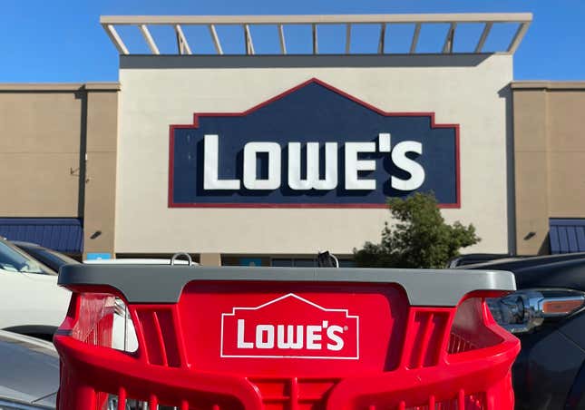 A shopping cart sits in front of a Lowe’s in Pacoima, California.