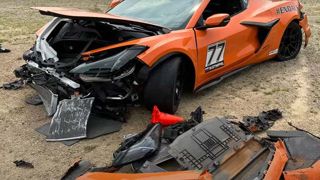 A heavily damaged, orange Chevrolet Corvette C8 Z06