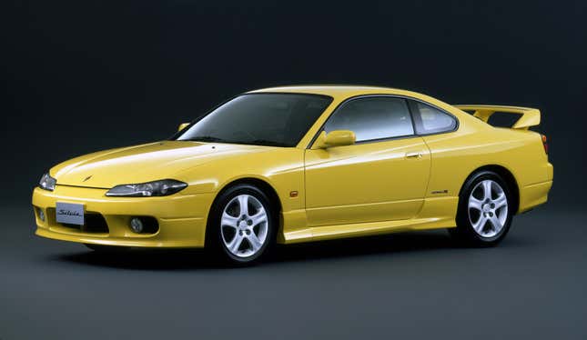 Front 3/4 view of a yellow Nissan Silvia