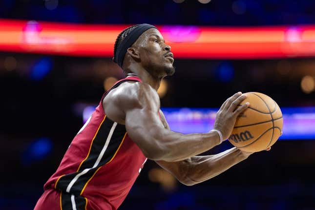 Apr 17, 2024; Philadelphia, Pennsylvania, USA; Miami Heat forward Jimmy Butler (22) lines up a shot against the Philadelphia 76ers during the second quarter of a play-in game of the 2024 NBA playoffs at Wells Fargo Center.