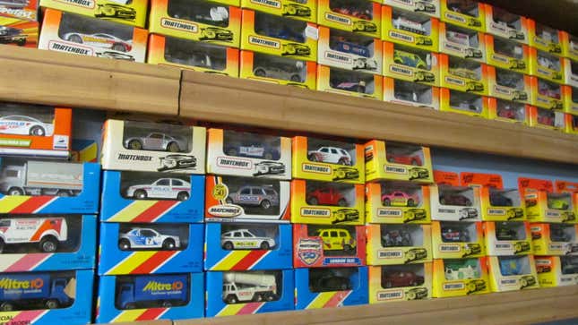 a wall display of numerous Matchbox toys inside their packaging