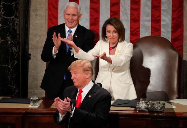 Pelosi gestures towards the congresswomen sitting in the audience when Trump gave them a shoutout.