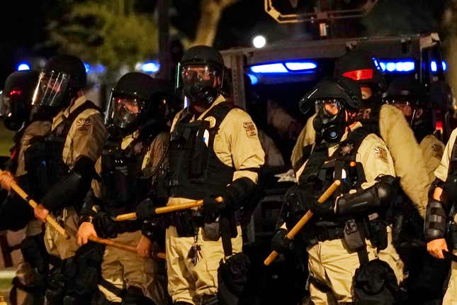 Police in riot gear surround the Arizona Capitol on June 24, 2022, in Phoenix, Arizona. 