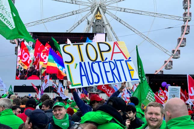 FILE - A protestor holds a sign which reads &#39;stop austerity&#39; during a demonstration against austerity measures in Brussels, Tuesday, Dec. 12, 2023. European Union finance ministers on Wednesday, Dec. 20, 2023, sealed a deal to reform the 27-nation bloc&#39;s fiscal rules after France and Germany finally adhered to a compromise. EU countries had been negotiating for months a reform of the bloc&#39;s fiscal rules limiting debt and deficits for member states, known as the Stability and Growth Pact. (AP Photo/Sylvain Plazy, File)