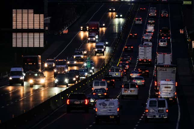 Motor vehicles move along Interstate 276 in Feasterville, Pa., Thursday, Dec. 21, 2023. (AP Photo/Matt Rourke)