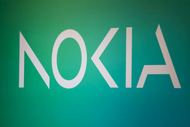 FILE - Nokia logo seen in the Mobile World Congress 2023 in Barcelona, Spain, Tuesday, Feb. 28, 2023. Nokia on Thursday reported a double-digit decline in sales and a fall in profit in the last three months of 2023, with the wireless and fixed-network equipment maker saying operators are cutting back on investments into 5G and other technology because of economic uncertainty. (AP Photo/Joan Mateu Parra, File)