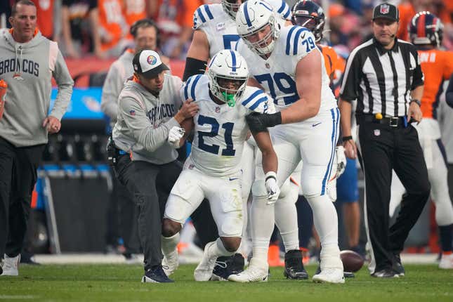 Indianapolis Colts running back Nyheim Hines (21) is helped up after being injured against the Denver Broncos during the first half of an NFL football game, Thursday, Oct. 6, 2022, in Denver.