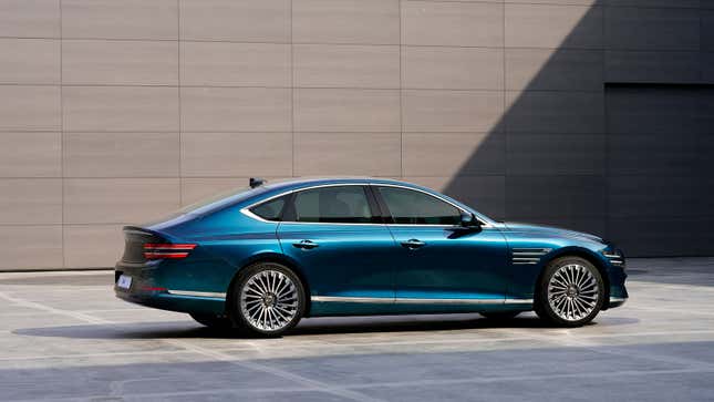 A photo of a teal Genesis Electrified G80 sedan. 