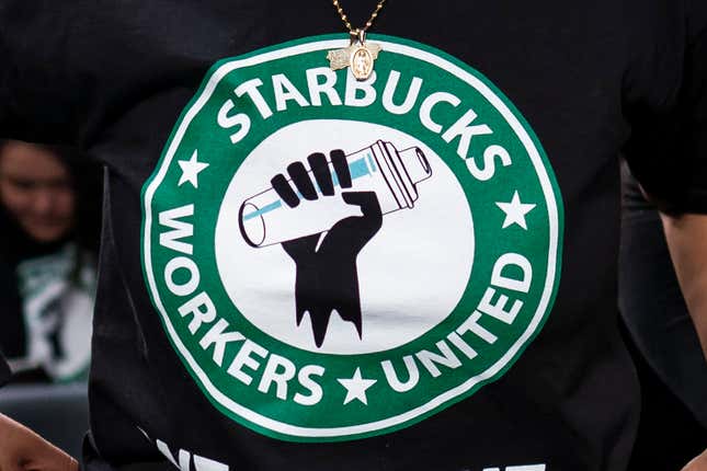 File - The Starbucks Workers United logo appears on the shirt of a person attending a hearing in Washington on March 29, 2023. Starbucks sued the union organizing its workers Wednesday, saying a pro-Palestine social media post from a union account early in the Israel-Hamas war angered hundreds of customers and damaged its reputation. (AP Photo/J. Scott Applewhite, File)