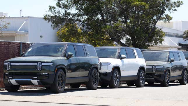 Rivian electric SUVs sit in front of a Rivian service center on August 08, 2023 in South San Francisco, California. 