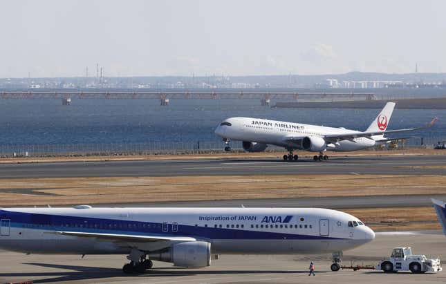 A Japan Airlines plane takes off from the runway at Haneda airport in Tokyo Monday, Jan. 8, 2024. Tokyo’s Haneda airport is almost back to its normal operation Monday as it reopened the runway a week after a fatal collision between a Japan Airlines airliner and a coast guard aircraft seen to have been caused by human error. (Kyodo News via AP)