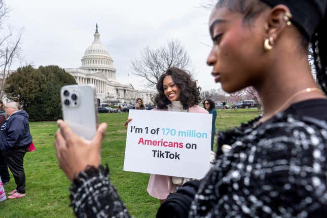 FILE - Devotees of TikTok, Mona Swain, center, and her sister, Rachel Swain, right, both of Atlanta, monitor voting at the Capitol in Washington, as the House passed a bill that would lead to a nationwide ban of the popular video app if its China-based owner doesn&#39;t sell, March 13, 2024. If some U.S. lawmakers have their way, the United States and China could end up with something in common: TikTok might not be available in either country. (AP Photo/J. Scott Applewhite, File)